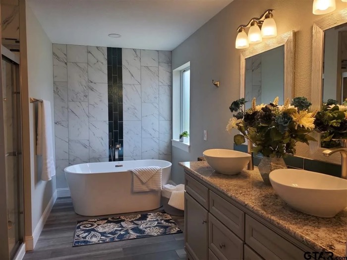 Remodeled primary bathroom with freestanding tub