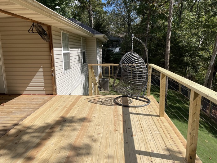 New wood deck with metal railing